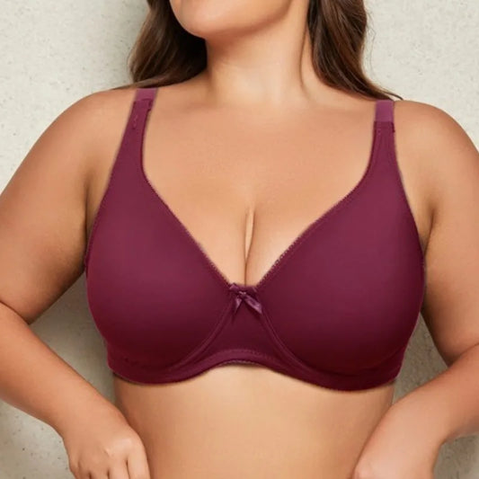 Purple bra worn by a person on a neutral background