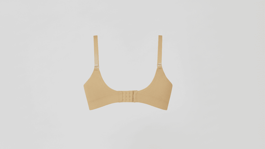 Beige bralette on a light gray background