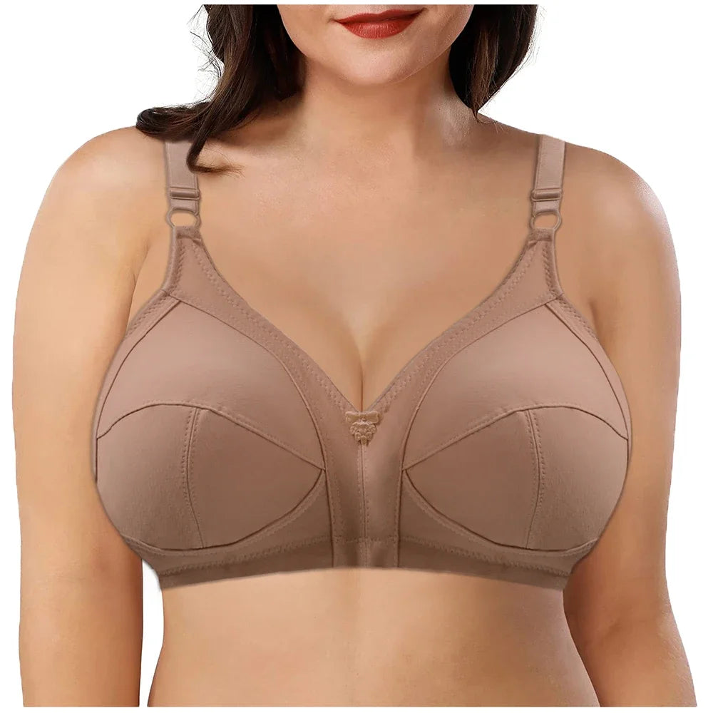 Beige bra worn by a model on a white background