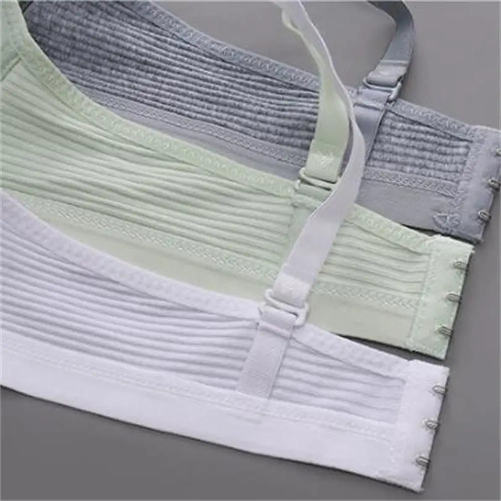 Close-up of a ribbed fabric garment with straps on a gray background