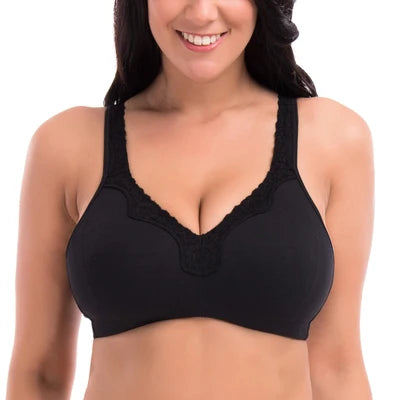 Woman wearing a black bra on a white background