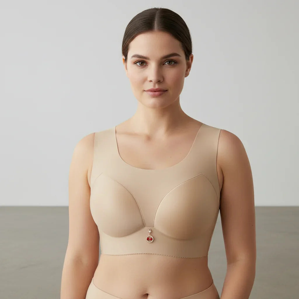 Woman wearing a beige compression garment against a plain background