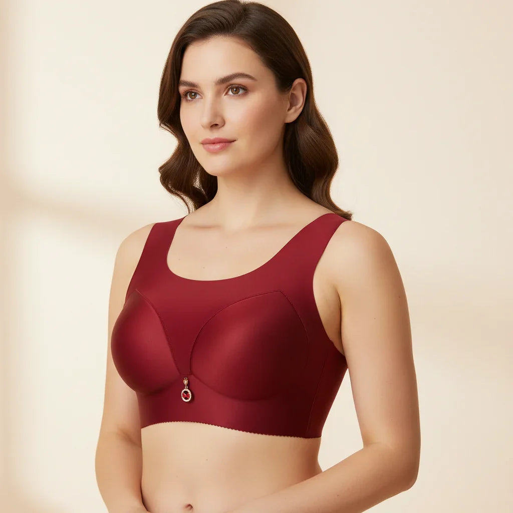 Woman wearing a red bralette against a beige background